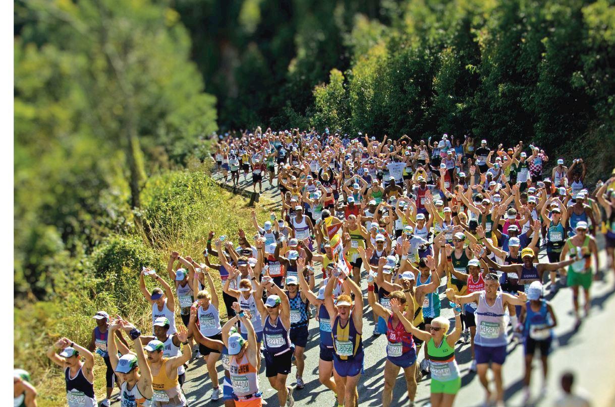 Diverse group of marathon runners racing together